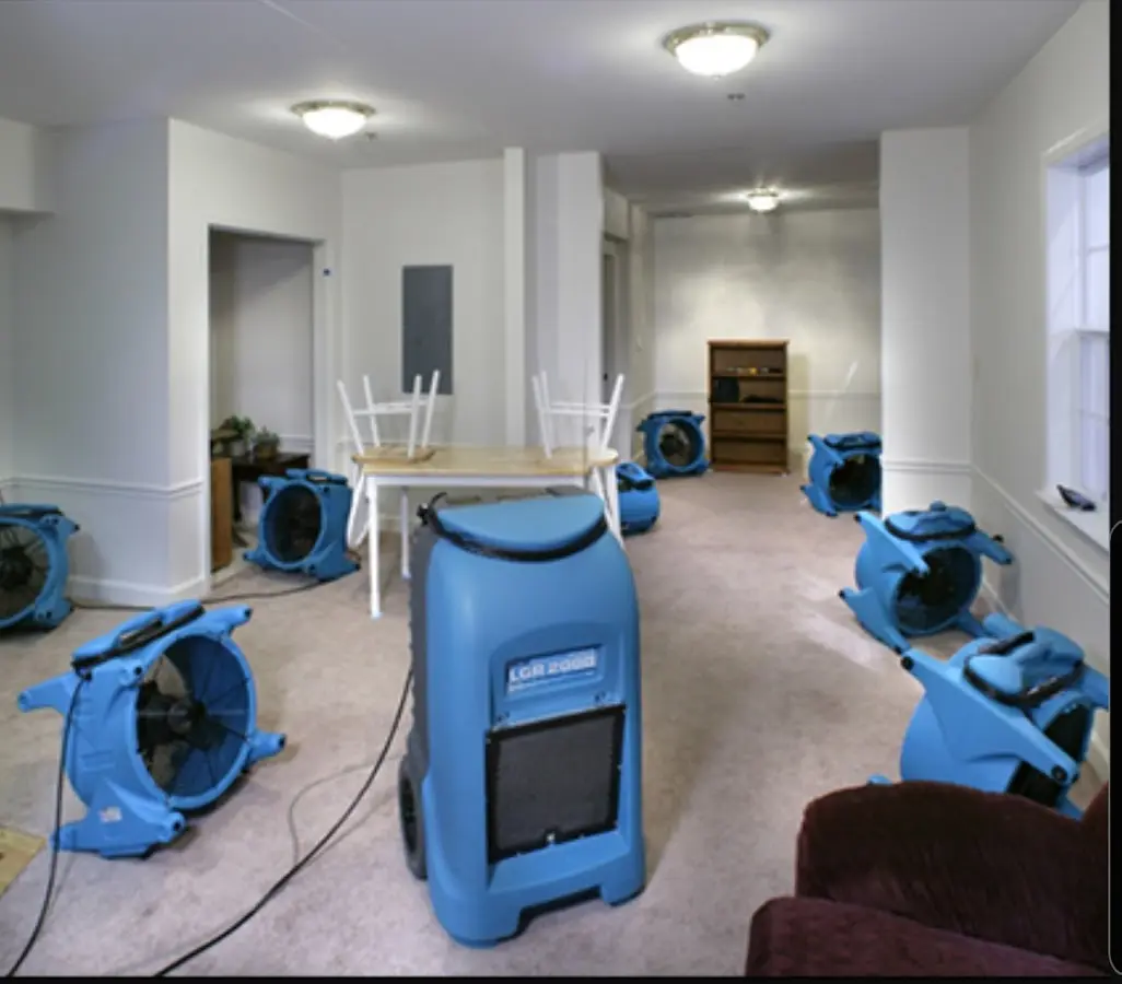 Air movers and dehumidifier setup for Water Damage Restoration in East Niles